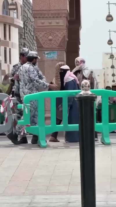 Recent incident at Masjid al-Nabawi where a security officer was hit by a woman, and in response, he hit her back.