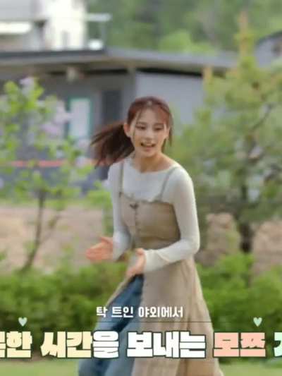 Tzuyu playing with her dogs