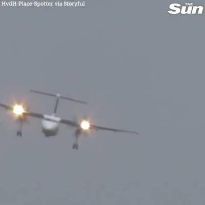 Dusseldorf Airport- Pilot expertly lands propeller plane in heavy crosswinds.