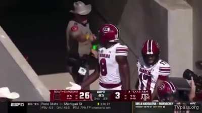 Texas A&M cop at Kyle Field shoves into two South Carolina football players after Nyck Harbor scores TD