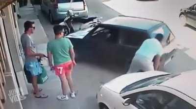 Chums seeing a guy lift a car...