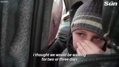 'We left our Dad in Kyiv' - young boy in tears as he escapes Russian advance in Ukraine