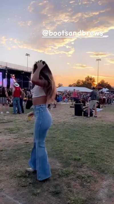 in jeans at Boots & Brews