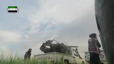 Jaysh al-Ababil cameraman films opposition technicals and infantry at work fighting in for al-Qayd - 2016