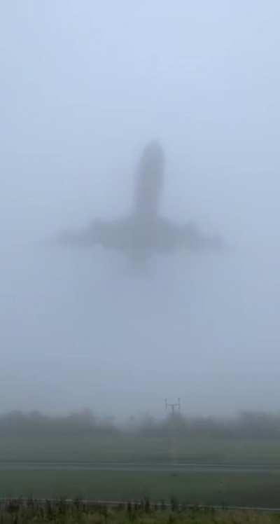 747 low pass on a foggy day