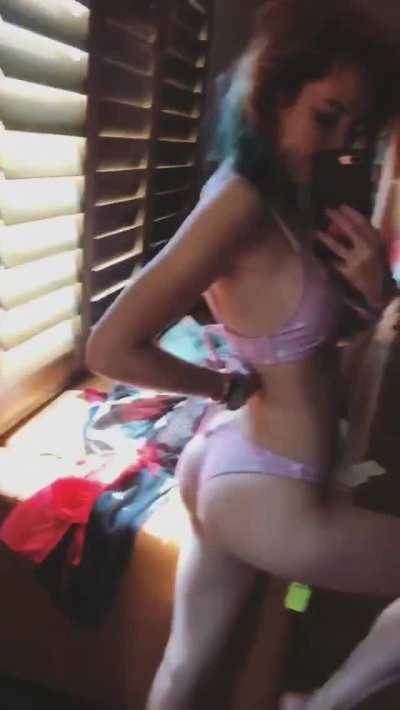 Showing off her ass in a new bikini