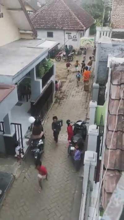 Kids chasing after a kite