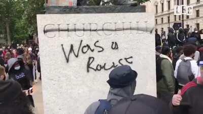 Winston Churchill's statue in Parliament Square has been vandalised as protest demonstrate against racism
