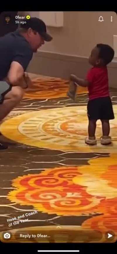 Coach Nurse playing games with Terence Davis’ kid