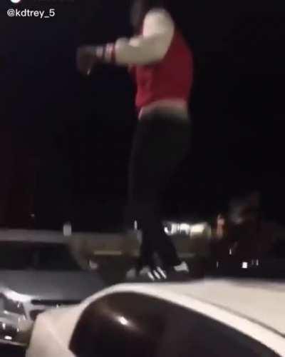 Gonna walk on the car holding a drink