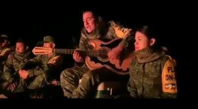Mexican military gathered around singing. And its pretty good..