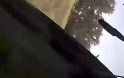 Russia: After a car hits author, the author roll over grass. 