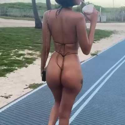 Edwina Carla Isaacs walking path in string bikini