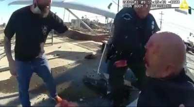 Police drag a man from a planet crash, which is then obliterated by a train