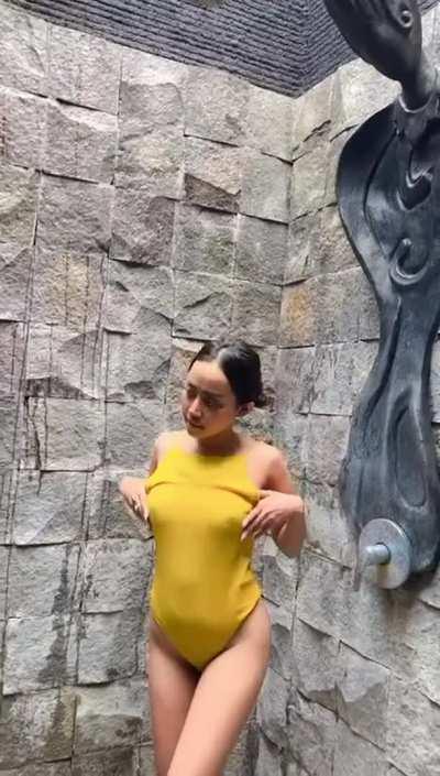 Do you think my ass looks nicer with or without this swimsuit?