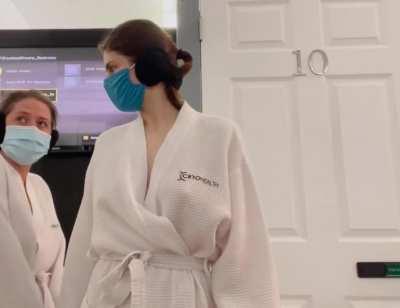 Alexandra Daddario teasing her boobs in a robe