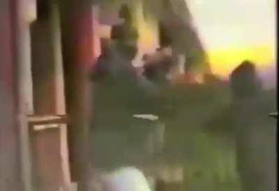 Belfast Brigade, PIRA firing from Beechmount Drive at a British Army Surveillance post at the top of Broadway Tower, Belfast, 1990