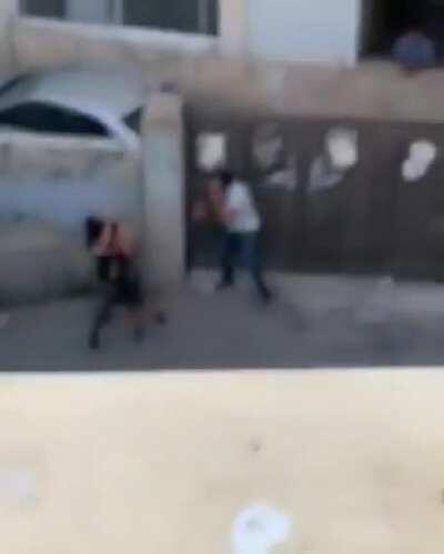 Undercover Israeli Police kidnap a Palestinian child and point a gun at a bystander filming