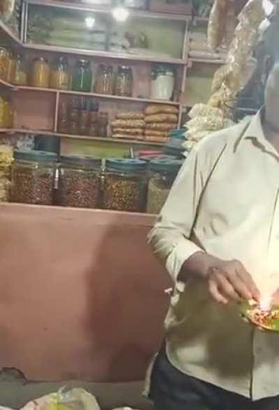 The priceless reaction of the first guy behind when the flaming betel nut was placed in her mouth!