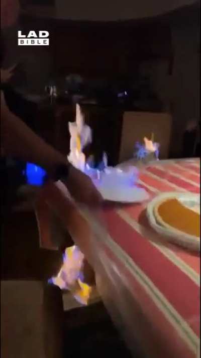Woman puts the whole kitchen table on fire..