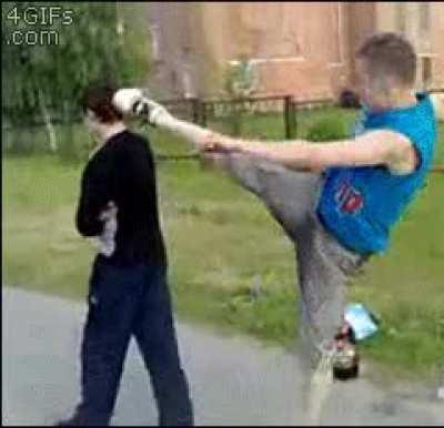 Trying to kick someone in the head from behind