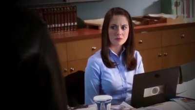 Annie Edison stuffs herself into a tight button down and talks softly