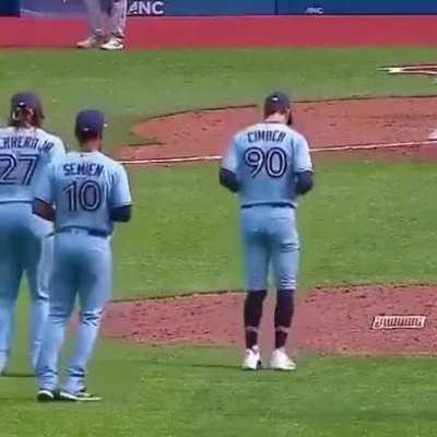 Marcus Semien and Vladimir Guerrero Jr. mimic Adam Cimber's warmup.