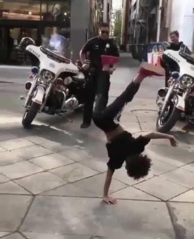 This kid wants to battle with a Police Officer on the floor!