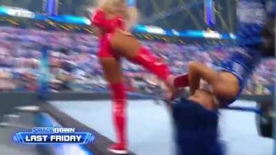 Sasha groans as Carmella knocks her out
