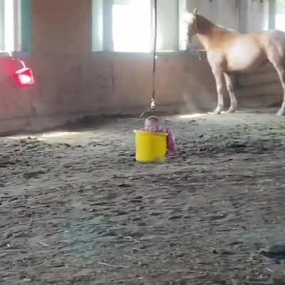 Mom and Dad make a homemade Carousel ride for baby