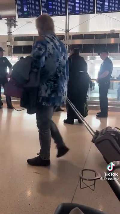 Possible hostage delivering written message to the US in Denver Airport