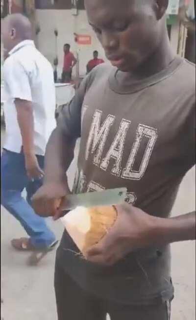 this man cuts the coconut perfectly so he can drink the water