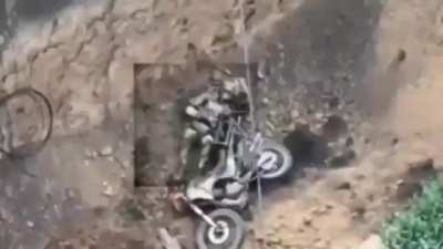 A Ukrainian drones watches a russian biker infantry attempted to cross an anti tank ditch and fail