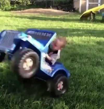 Kid doing a sick wheelie.
