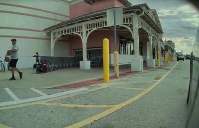 Woman at walmart almost hits me, nearly runs over a mother & child, and proceeds to attempt to physically attack me.