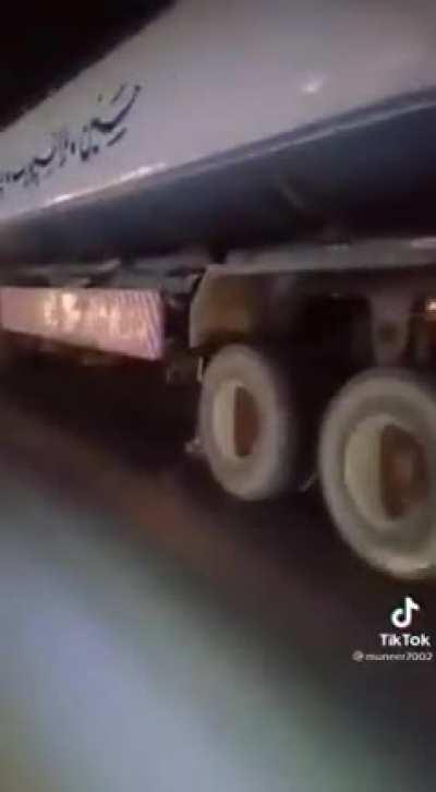 Rollerblading while holding onto a 18 wheeler truck
