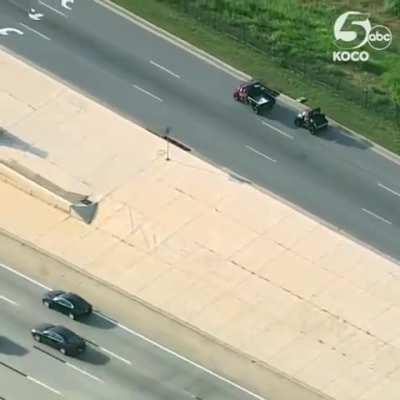 Helicopter footage of a loose cow being wrangled by Emergency Services and cowboys in OKC