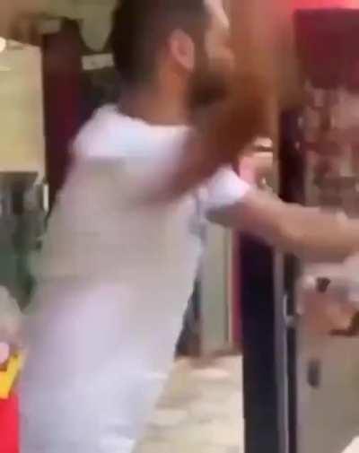 Palestinian slaps reporter after asked to kiss Israeli flag for $1000.