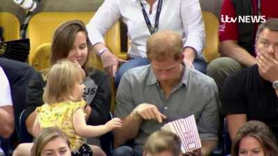 Kid gets caught stealing Prince Harry's popcorn
