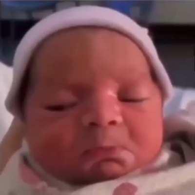 Baby immediately realizes what kind of world she came into.