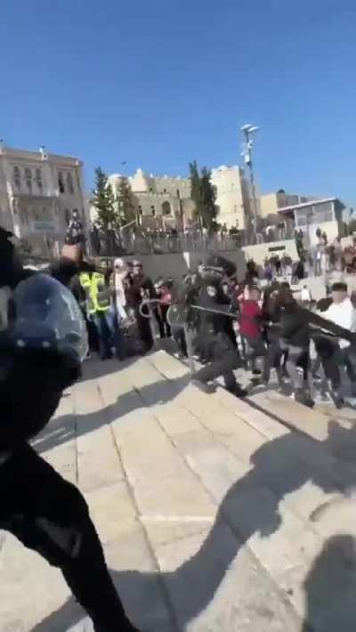 Israeli forces attacking a Palestinian girl