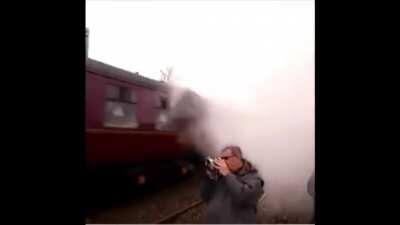 Idiot stands too close to train tracks