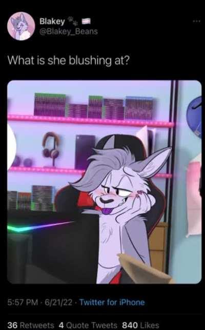 What is she blushing at?