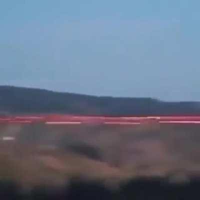 A 20 mm M197 electric gatling rotary cannon that can use tracer ammunition in action at a drill.