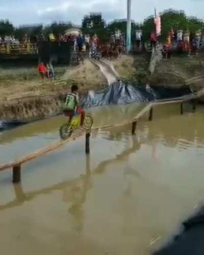 Cycling over wooden narrow strip