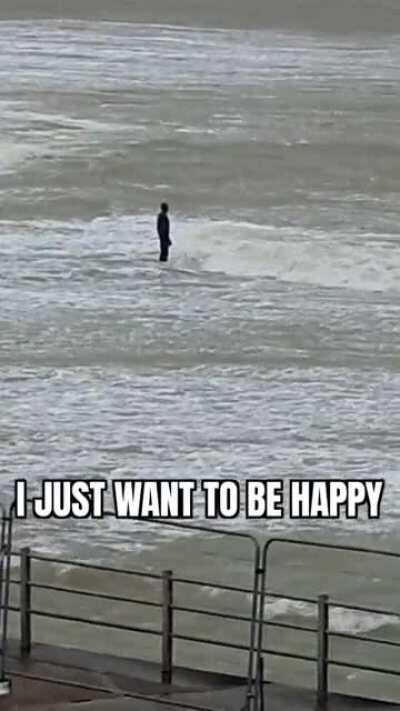 A man contenplating his existence at -1° whiles it's also snowing