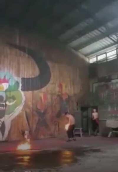 Performer playing with fire. What do you expect?