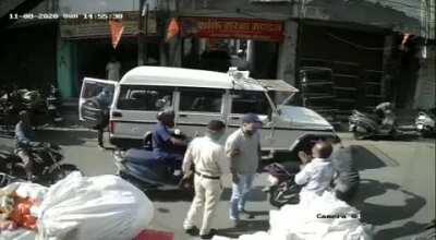 Cop in India opens a door of his car and makes bikers crash. Then beats them up