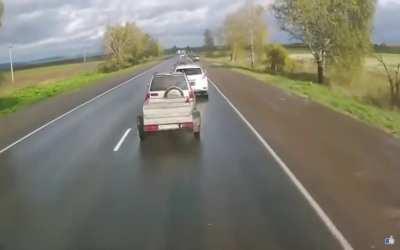 Russia: Truck hits parked cars