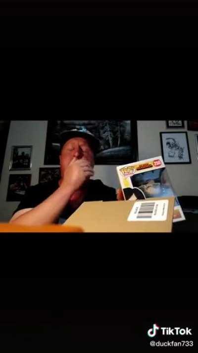 Guy crying over a funko pop